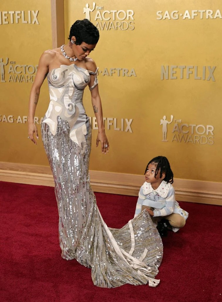 Teyana Taylor, wearing custom Thom Browne, and Rue Rose Shumpert attend the 32nd Annual Actor Awards at Shrine Auditorium and Expo Hall on March 1, 2026 in Los Angeles, California. Source: Getty